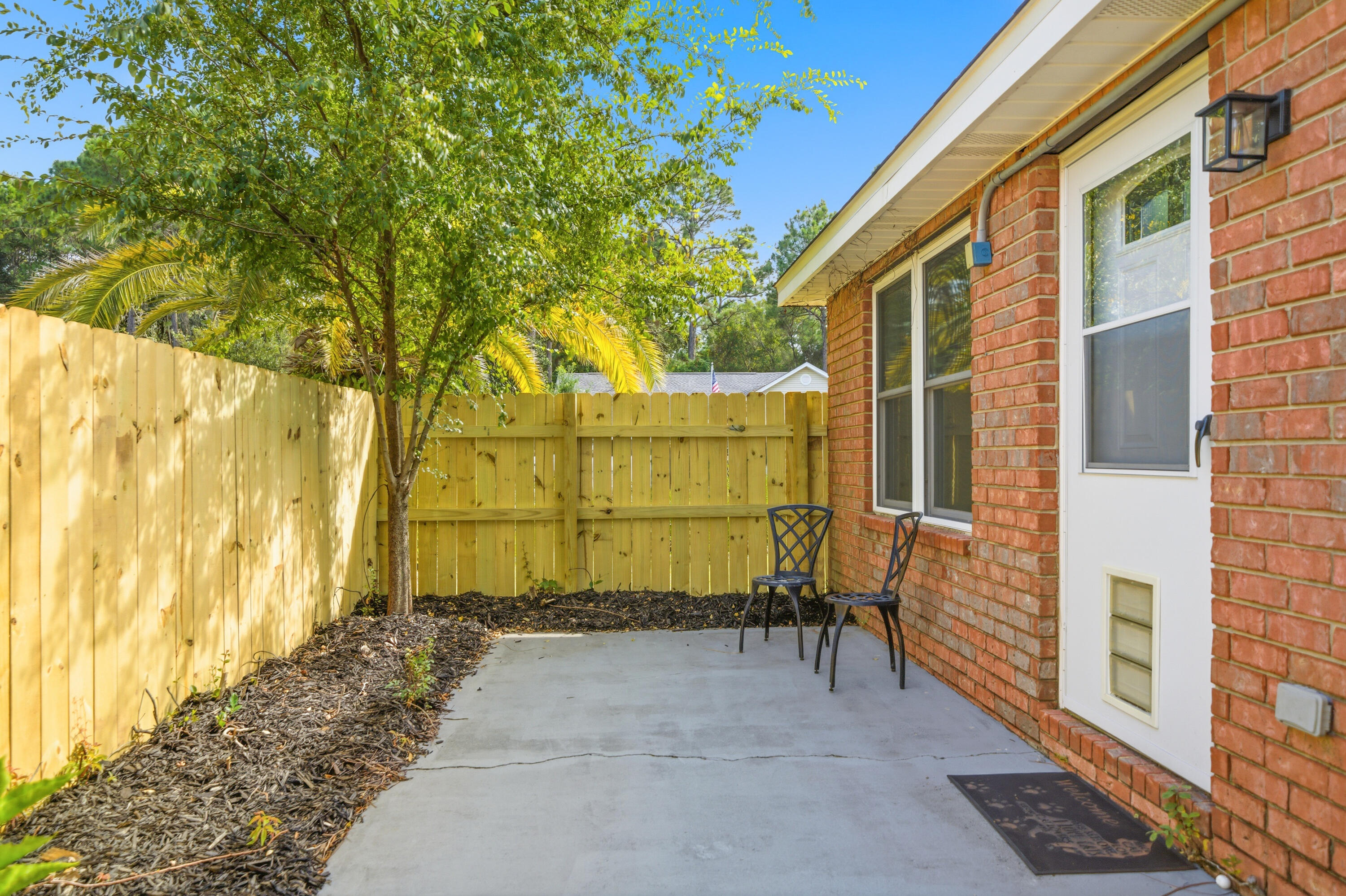 3879 Mesa Road Destin, FL 32541 - Photo 22 of 27 a view of a back yard of the house