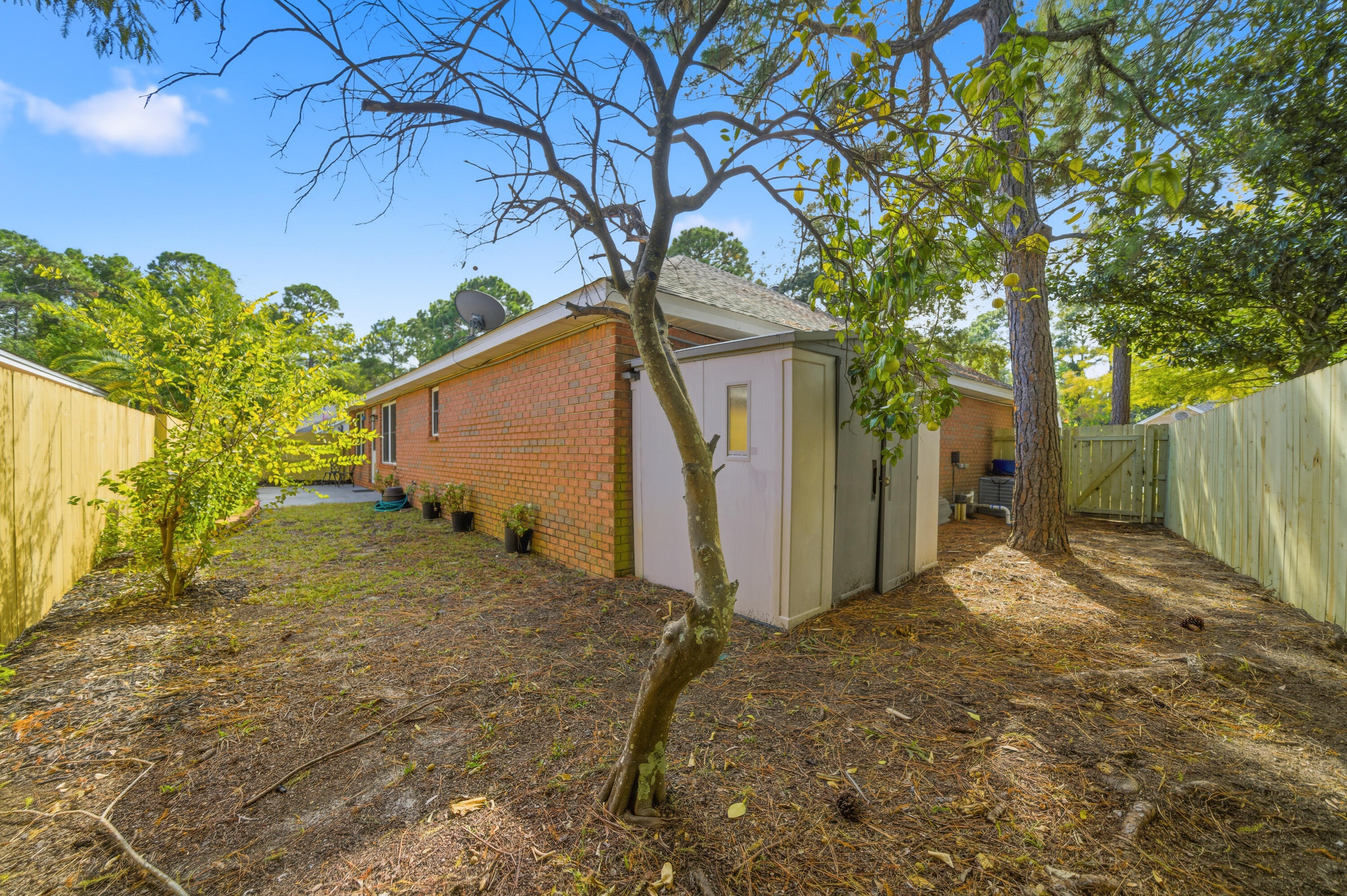 3879 Mesa Road Destin, FL 32541 - Photo 23 of 27 a backyard of a house