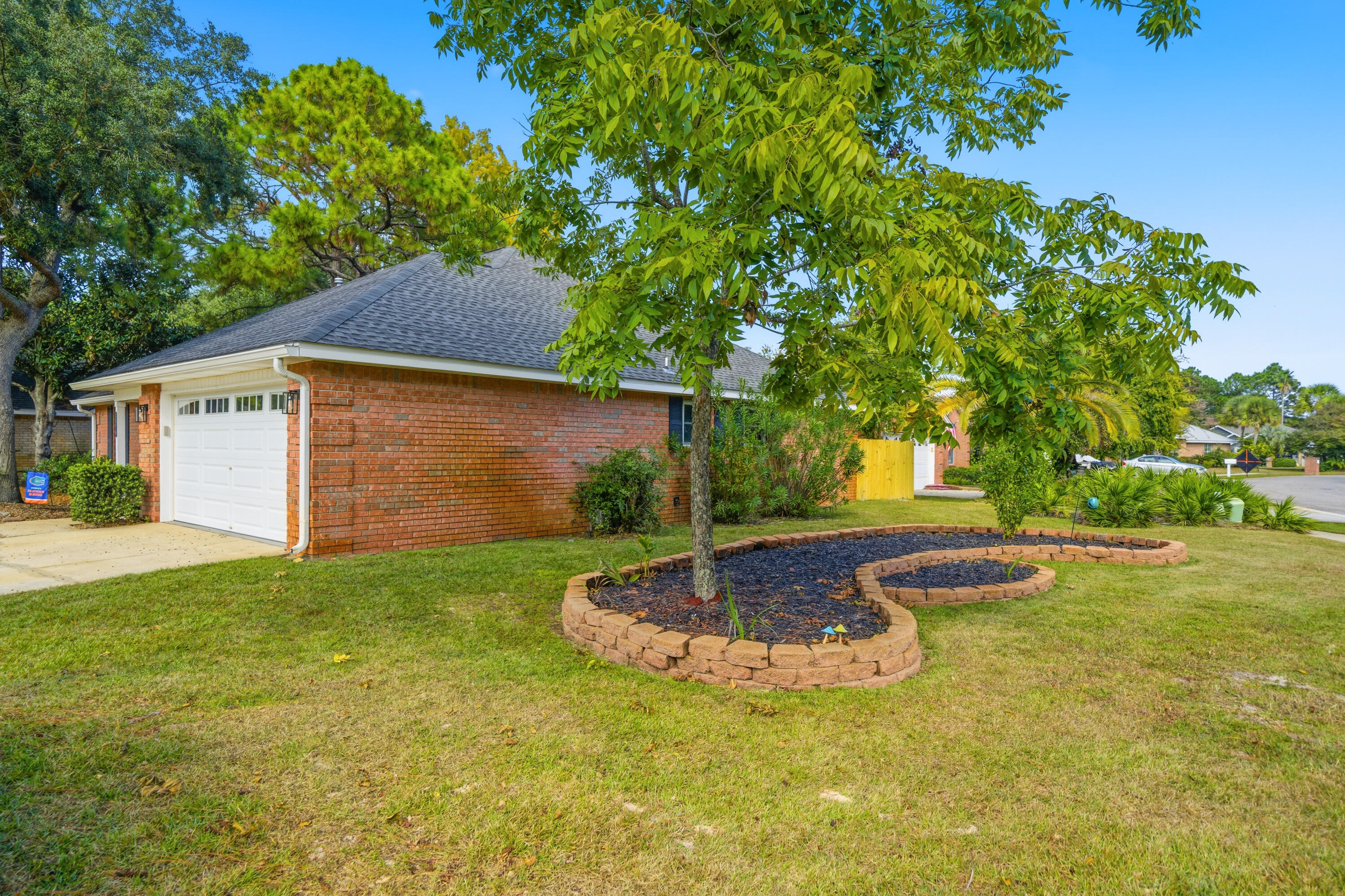 3879 Mesa Road Destin, FL 32541 - Photo 3 of 27 a view of a backyard with green space