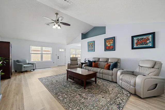 a living room with furniture and a couch