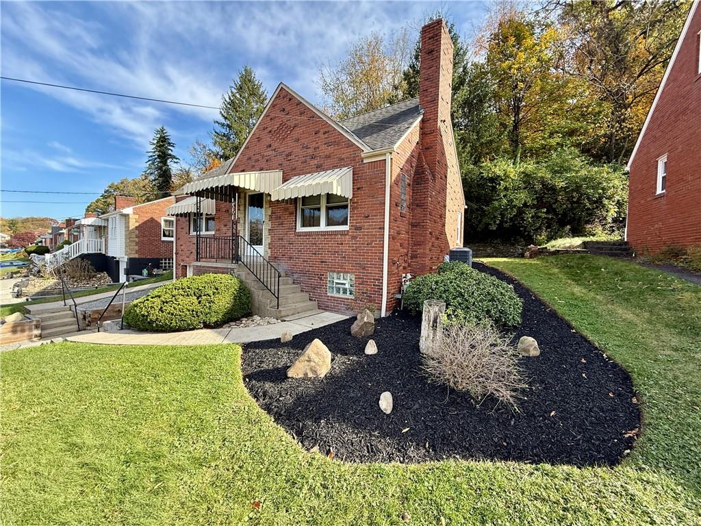 1320 Main Street Bridgeville, PA 15017 - Photo 2 of 26 a front view of a house with garden