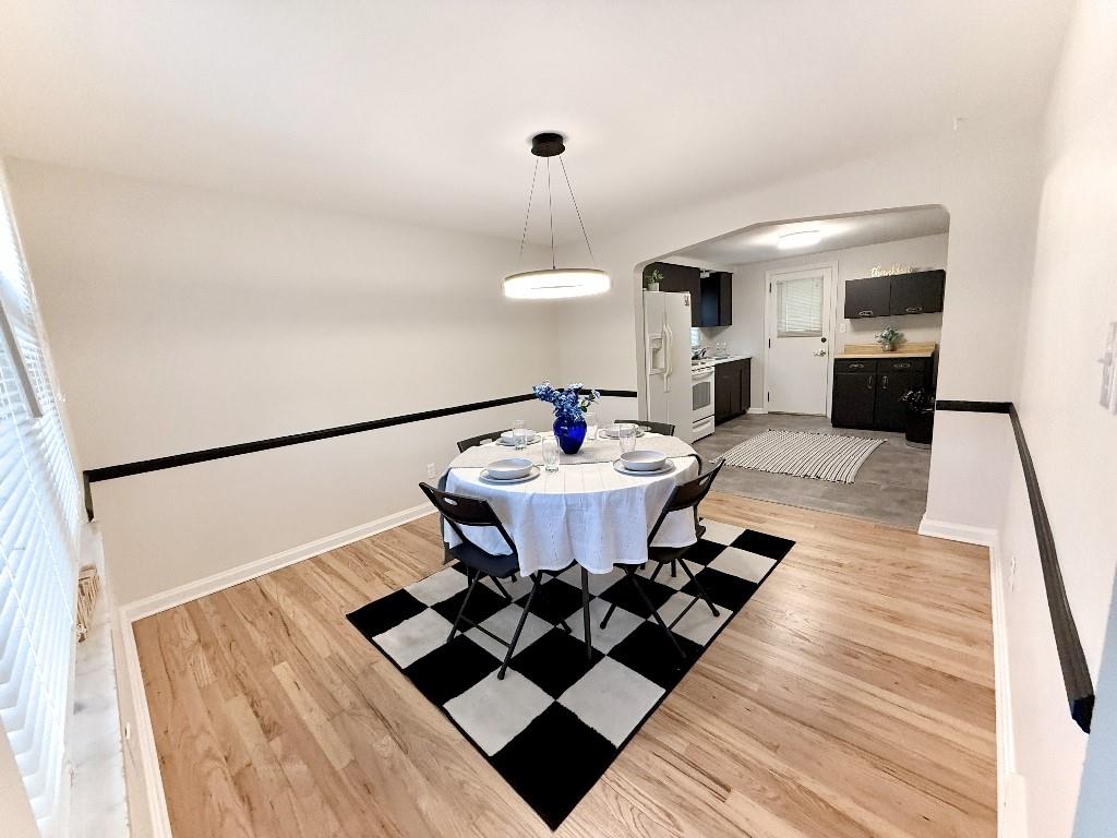 1320 Main Street Bridgeville, PA 15017 - Photo 6 of 26 a living room with a sink and a table
