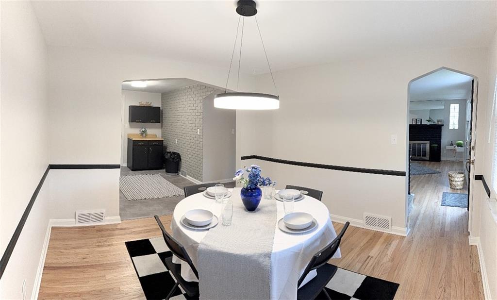 1320 Main Street Bridgeville, PA 15017 - Photo 7 of 26 a view of a dining room with furniture and wooden floor