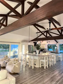 a view of a patio with table and chairs and couches