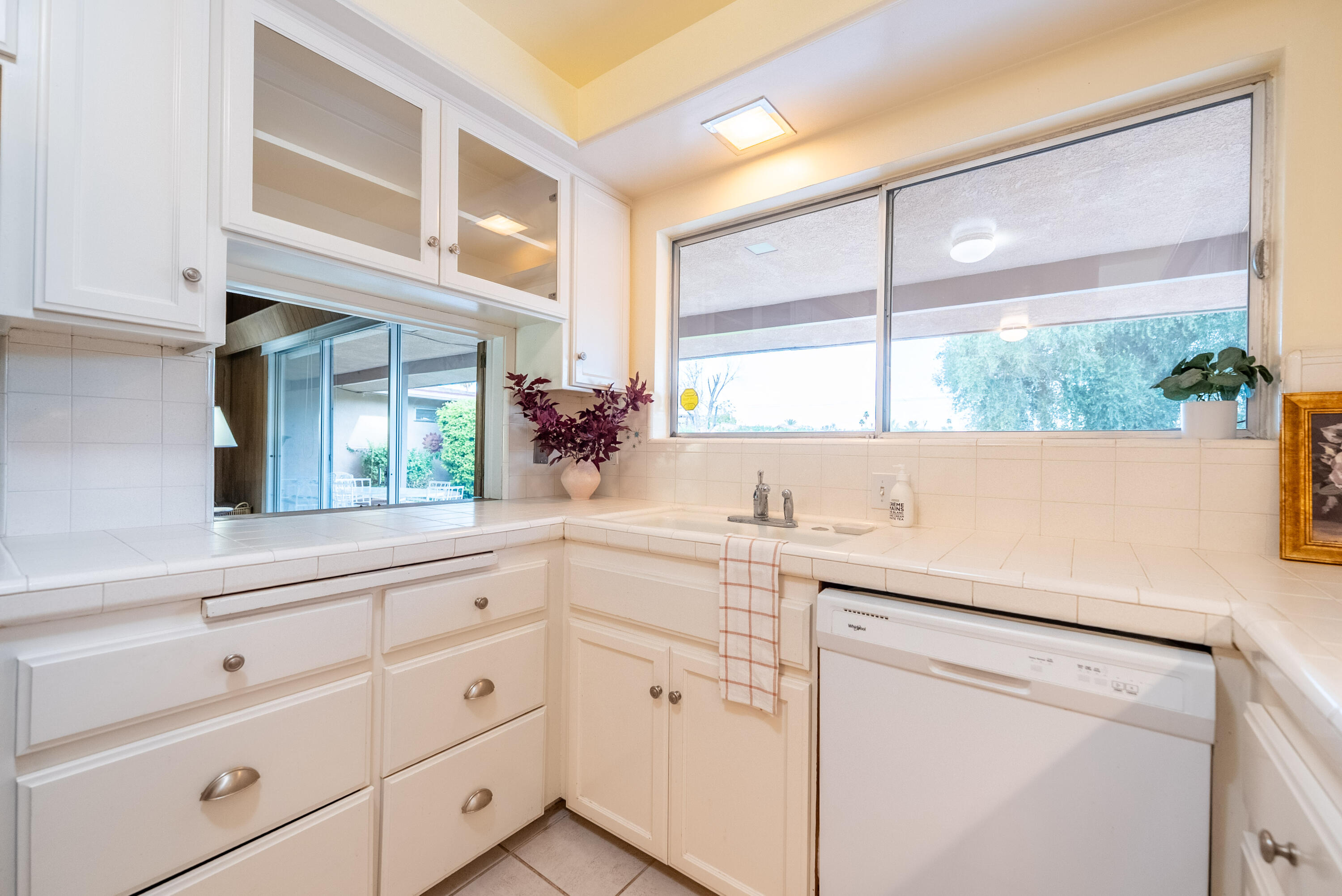 167 Santa Rosa Road El Centro, CA 92243 - Photo 15 of 50 a view of cabinets a oven and a window with white cabinets