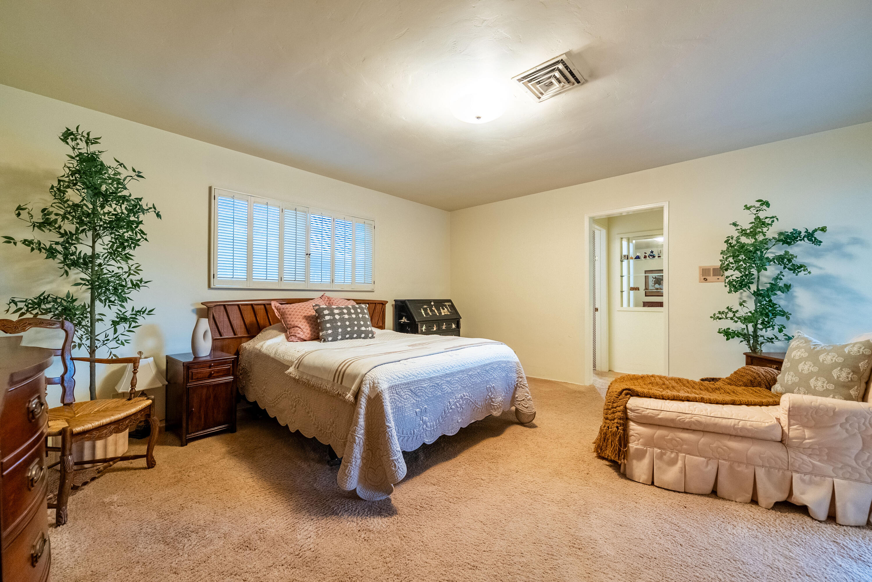 167 Santa Rosa Road El Centro, CA 92243 - Photo 26 of 50 a spacious bedroom with a bed and a couch