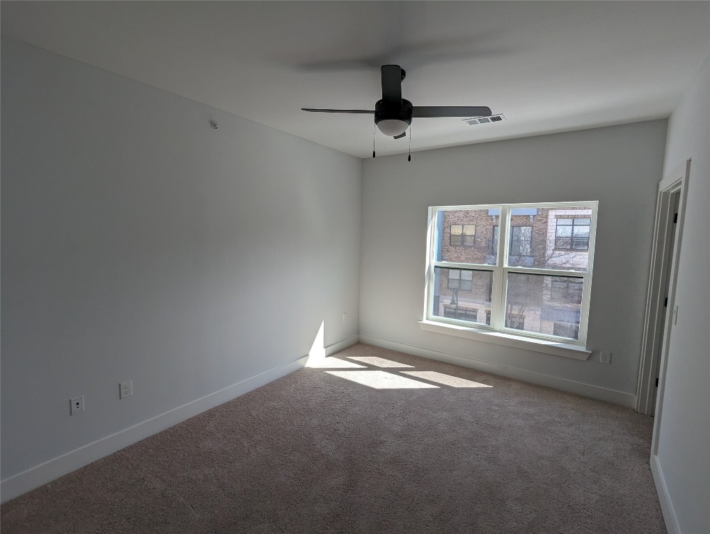 2500 Longview Street, Unit 322 Austin, TX 78705 - Photo 16 of 25 an empty room with a empty space and windows