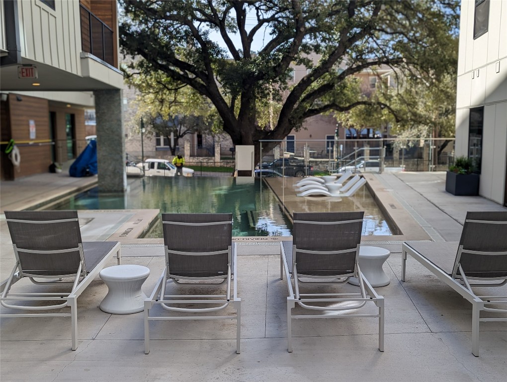2500 Longview Street, Unit 322 Austin, TX 78705 - Photo 20 of 25 a view of a patio with swimming pool table and chairs