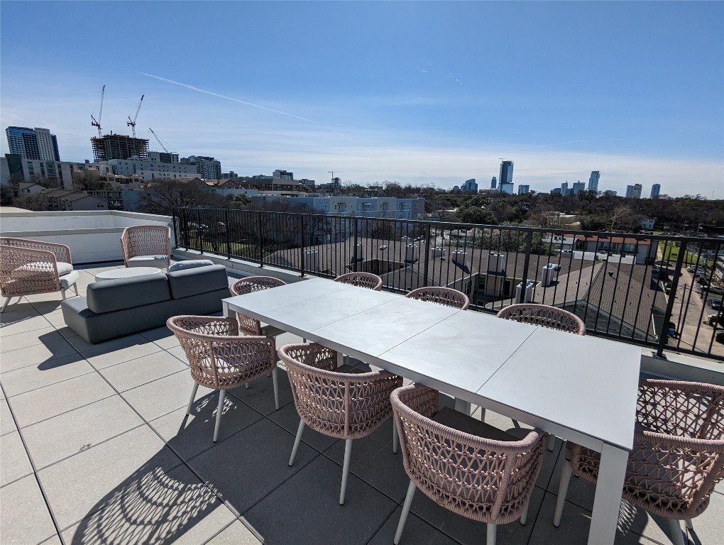 2500 Longview Street, Unit 322 Austin, TX 78705 - Photo 23 of 25 a terrace with outdoor seating and city view