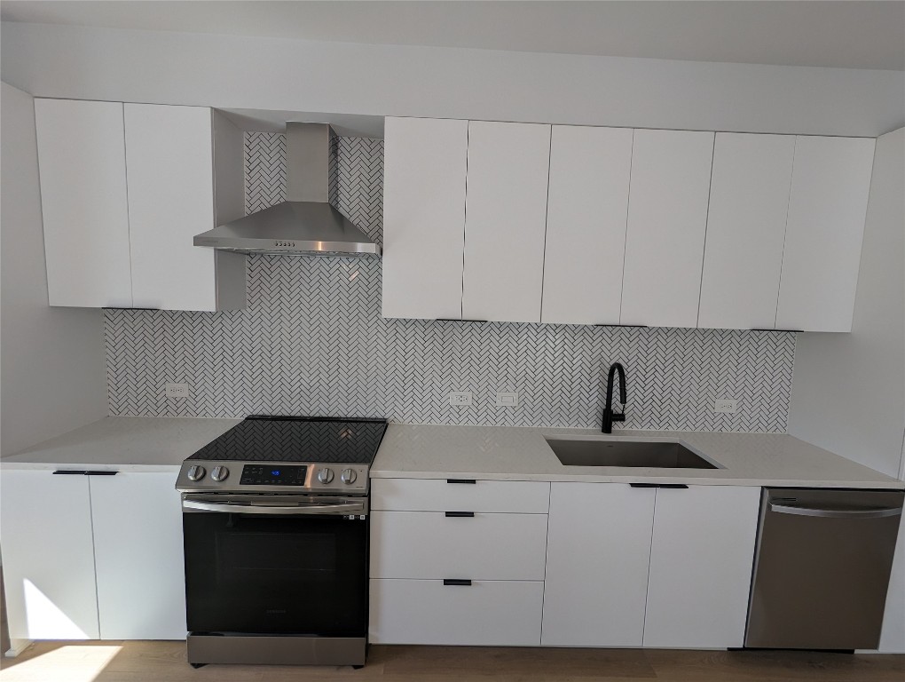 2500 Longview Street, Unit 322 Austin, TX 78705 - Photo 5 of 25 a kitchen with white cabinets and appliances