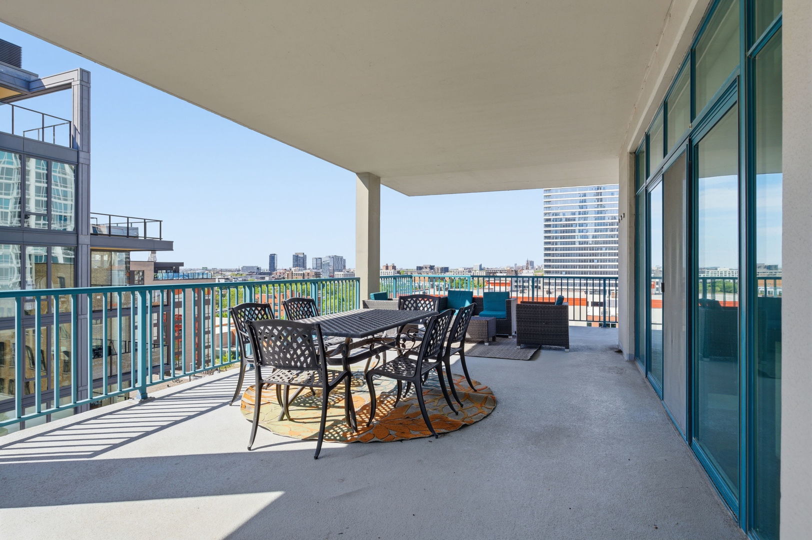 340 West Superior Street, Unit 1009 Chicago, IL 60654 - Photo 15 of 24 a view of a terrace with furniture and floor to ceiling window