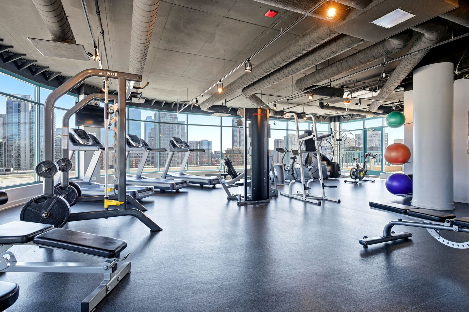 340 West Superior Street, Unit 1009 Chicago, IL 60654 - Photo 19 of 24 a view of a room with gym equipment
