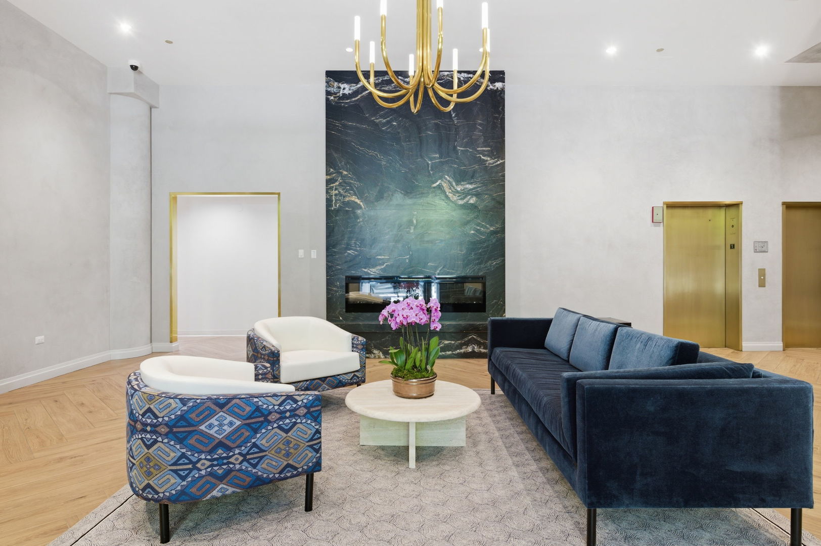 340 West Superior Street, Unit 1009 Chicago, IL 60654 - Photo 20 of 24 a living room with furniture and a chandelier