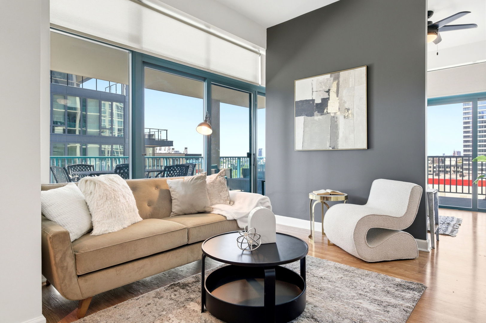340 West Superior Street, Unit 1009 Chicago, IL 60654 - Photo 3 of 24 a living room with furniture and a large window