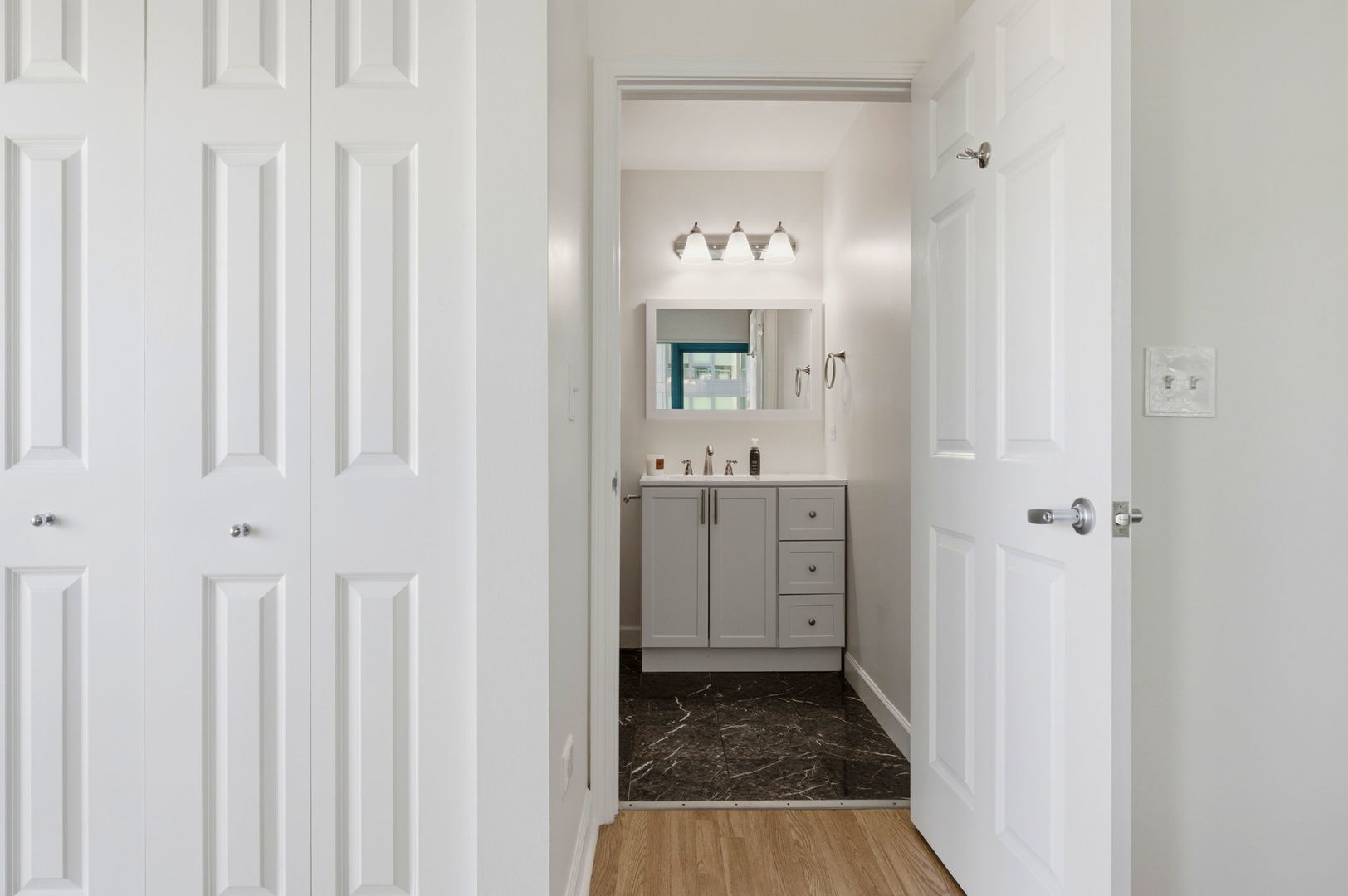 340 West Superior Street, Unit 1009 Chicago, IL 60654 - Photo 10 of 24 a bathroom with a sink and a mirror