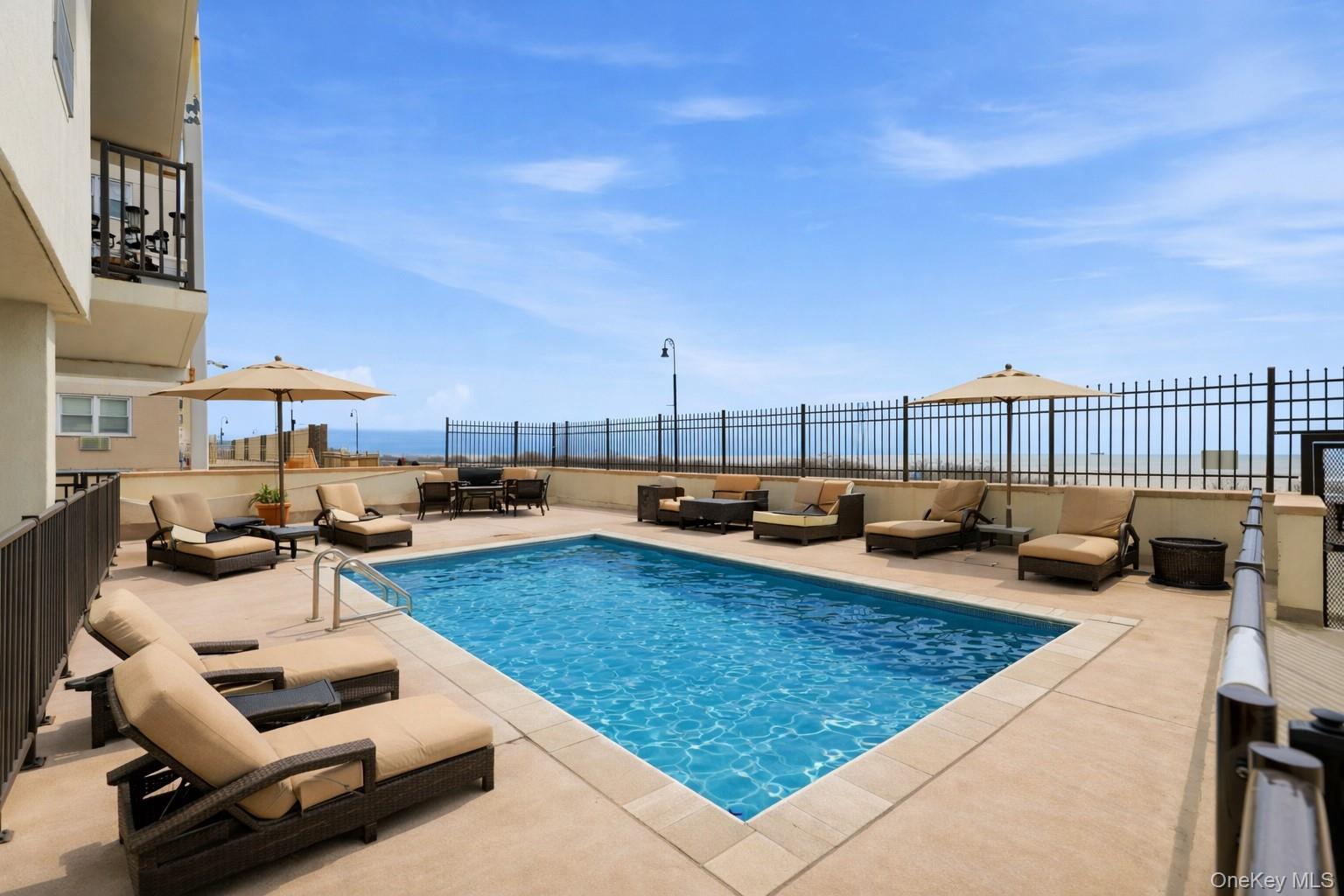 420 Shore Road, Unit 3M Long Beach, NY 11561 - Photo 11 of 23 View of swimming pool with patio surround and an outdoor lounge area