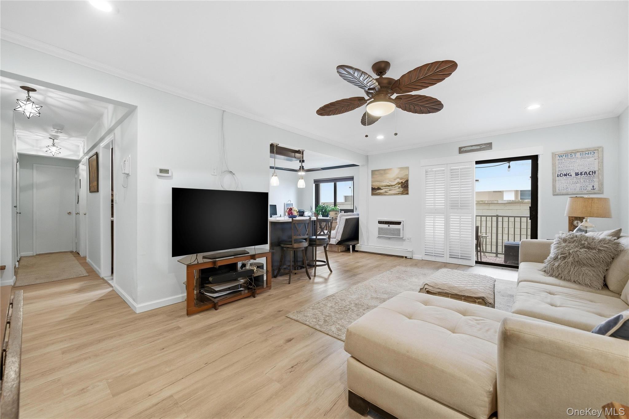 420 Shore Road, Unit 3M Long Beach, NY 11561 - Photo 2 of 23 Living area featuring crown molding, light wood finished floors, recessed lighting, and ceiling fan