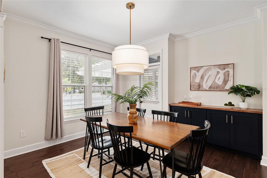 303 Southwest 129 Terrace Newberry, FL 32669 - Photo 13 of 75 a dining room with furniture a window and wooden floor