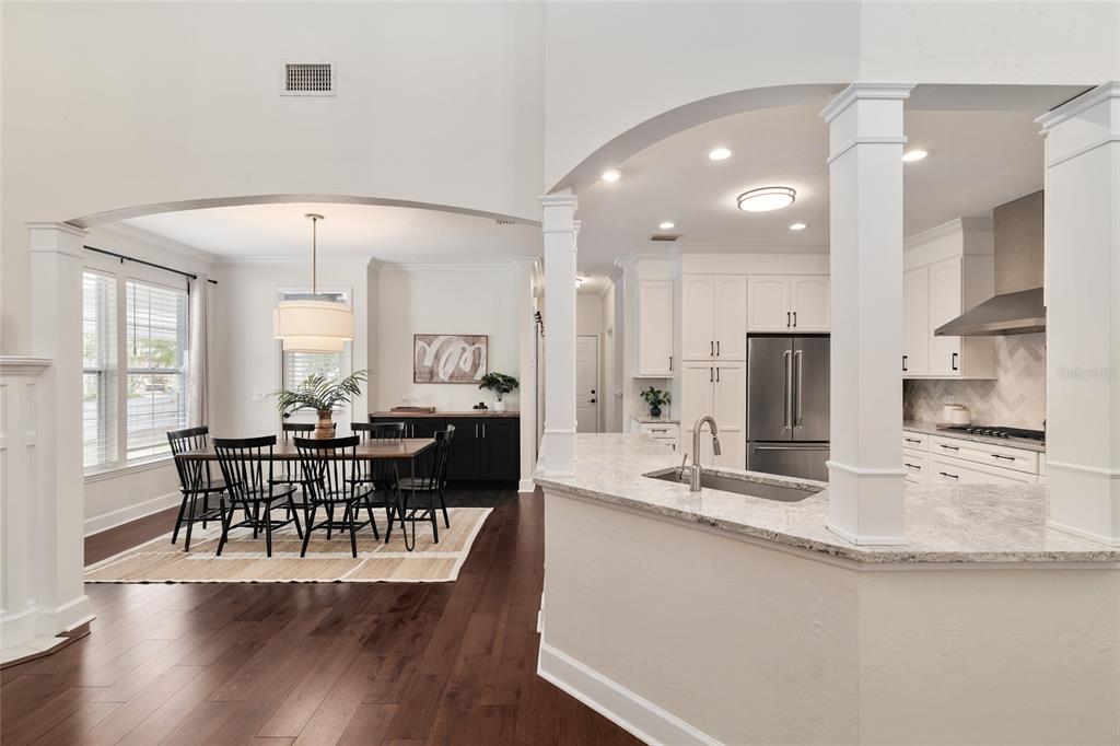 303 Southwest 129 Terrace Newberry, FL 32669 - Photo 14 of 75 a view of a dining room with furniture and wooden floor