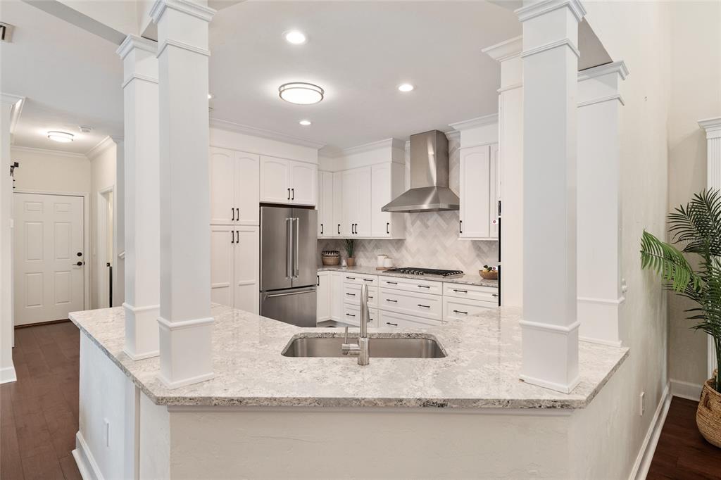 303 Southwest 129 Terrace Newberry, FL 32669 - Photo 15 of 75 a kitchen with kitchen island granite countertop a sink stove and refrigerator