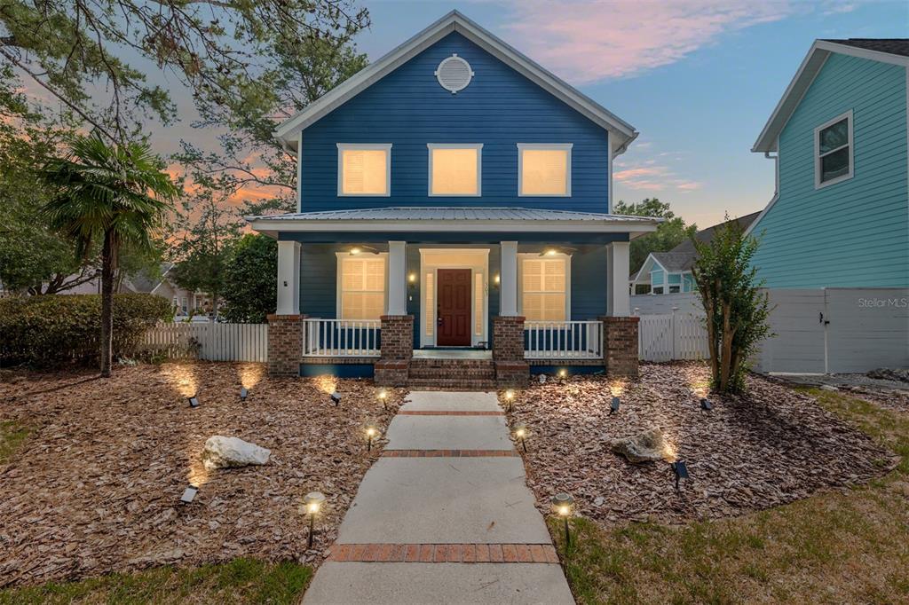 303 Southwest 129 Terrace Newberry, FL 32669 - Photo 2 of 75 a front view of a house with a yard
