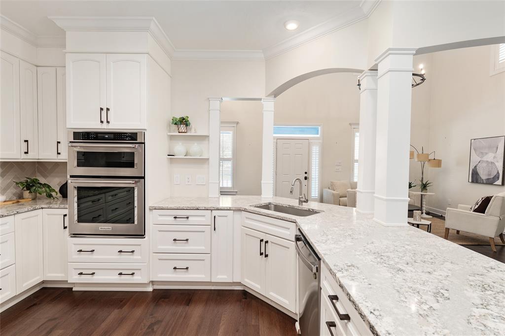 303 Southwest 129 Terrace Newberry, FL 32669 - Photo 21 of 75 a kitchen with cabinets appliances and a counter space