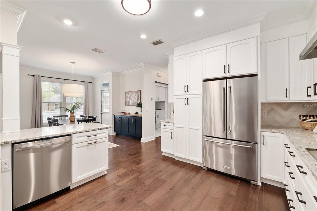 303 Southwest 129 Terrace Newberry, FL 32669 - Photo 22 of 75 a kitchen with stainless steel appliances a refrigerator sink and cabinets