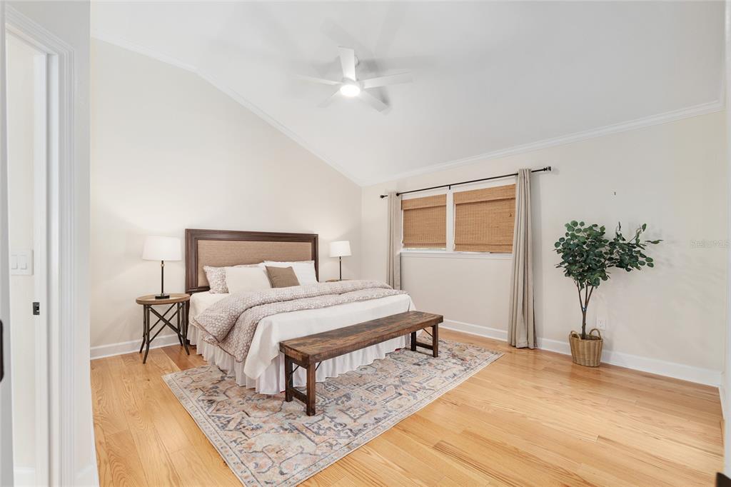 303 Southwest 129 Terrace Newberry, FL 32669 - Photo 27 of 75 a bedroom with a bed and a potted plant