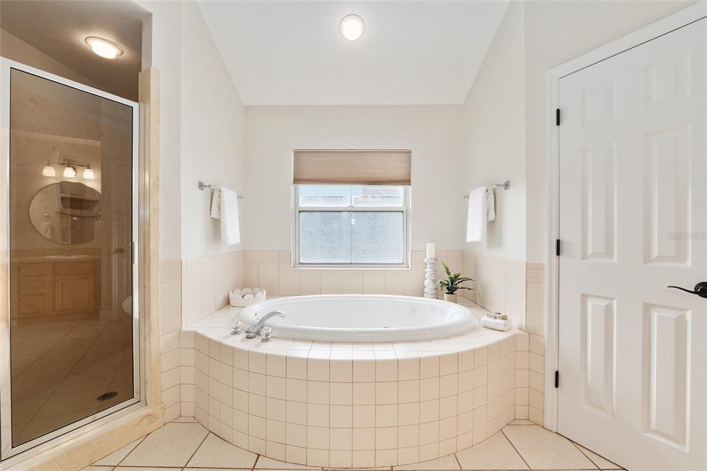 303 Southwest 129 Terrace Newberry, FL 32669 - Photo 33 of 75 a bathroom with bathtub and shower