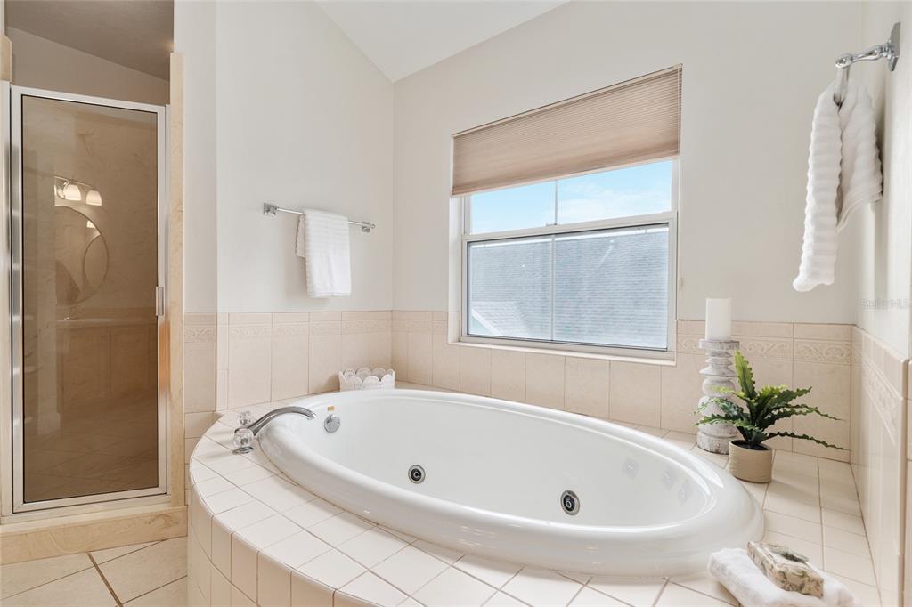 303 Southwest 129 Terrace Newberry, FL 32669 - Photo 34 of 75 a white bath tub sitting in a bathroom next to a window