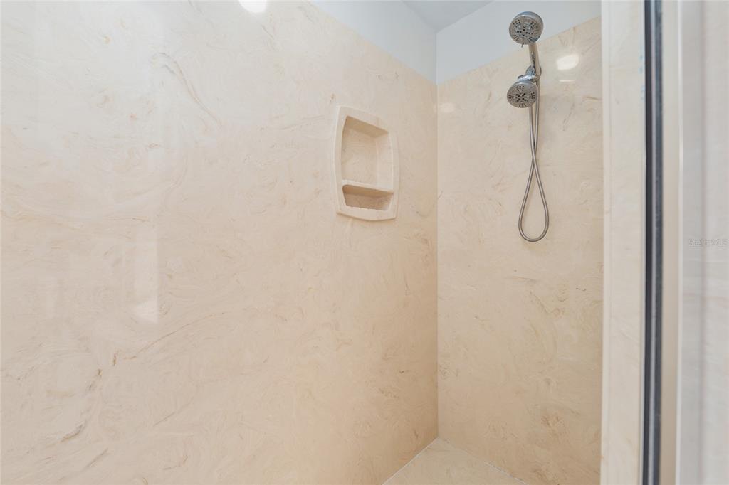303 Southwest 129 Terrace Newberry, FL 32669 - Photo 35 of 75 a bathroom with a glass shower door