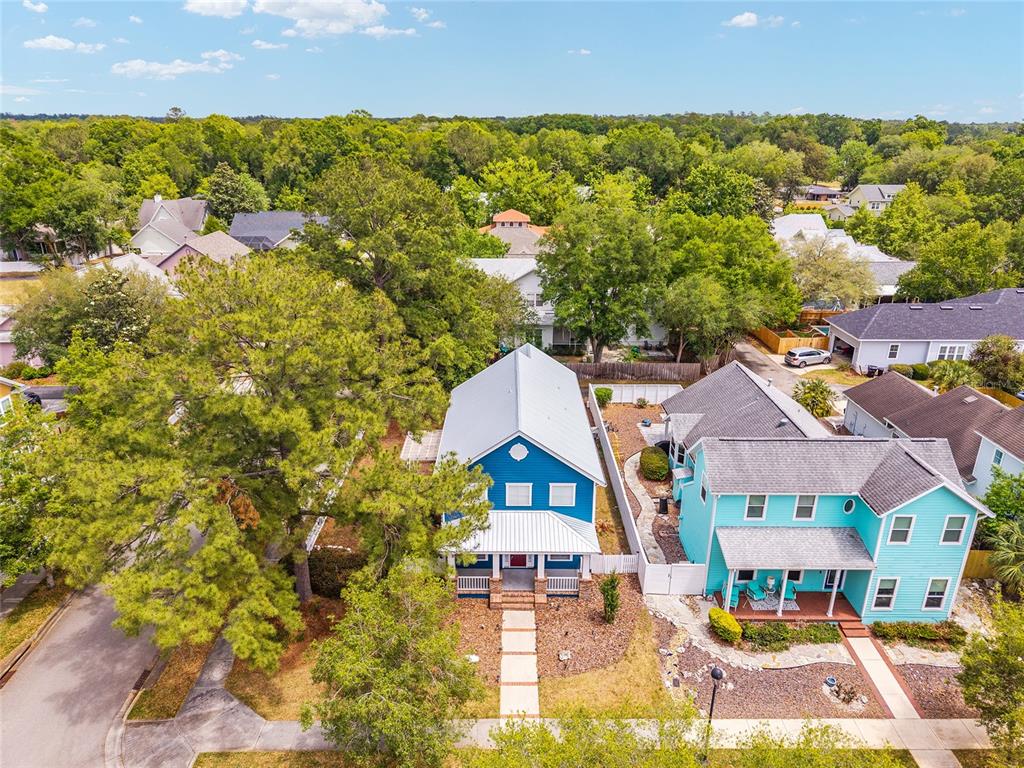 303 Southwest 129 Terrace Newberry, FL 32669 - Photo 60 of 75 an aerial view of residential houses with outdoor space and trees