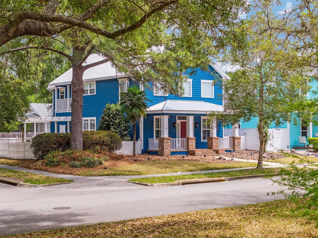 303 Southwest 129 Terrace Newberry, FL 32669 - Photo 74 of 75 a front view of a house with garden