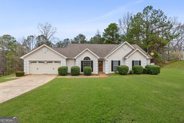 front view of a house with a yard