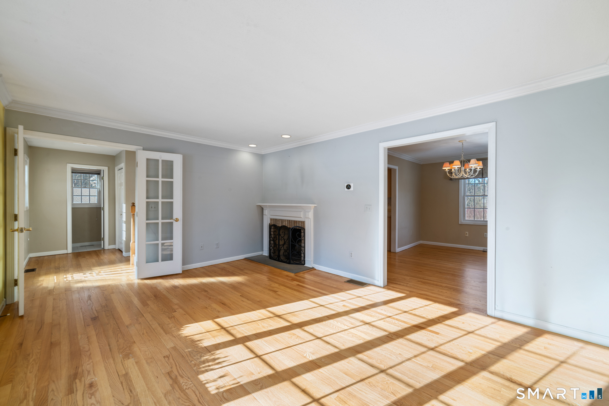 165 Garrigus Court Wolcott, CT 06716 - Photo 12 of 40 a view of a livingroom with wooden floor and cabinet