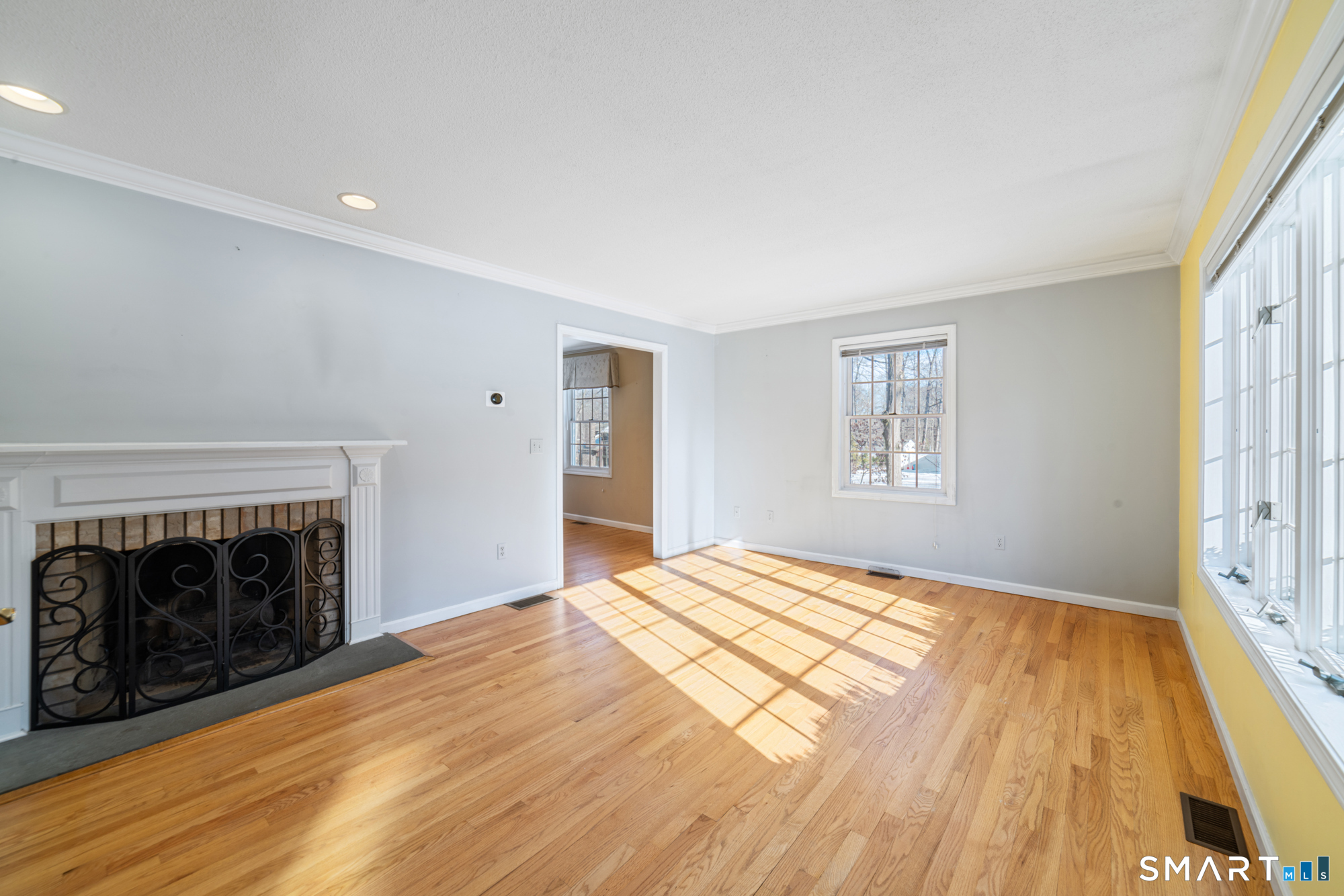 165 Garrigus Court Wolcott, CT 06716 - Photo 13 of 40 a bedroom with a bed and a fireplace