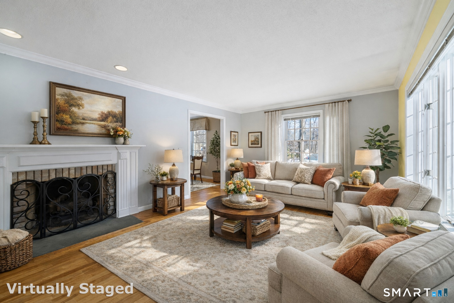 165 Garrigus Court Wolcott, CT 06716 - Photo 14 of 40 a living room with furniture a fireplace and a flat screen tv