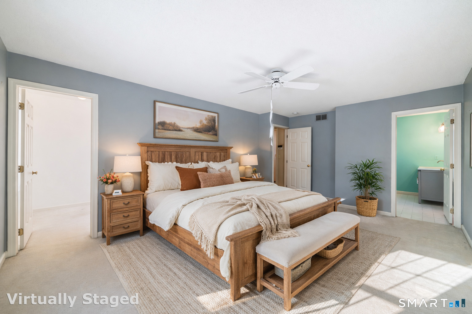 165 Garrigus Court Wolcott, CT 06716 - Photo 20 of 40 a spacious bedroom with a bed and a chandelier