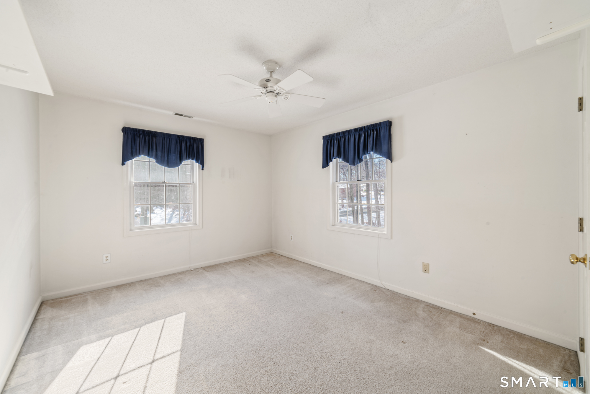 165 Garrigus Court Wolcott, CT 06716 - Photo 25 of 40 an empty room with windows and closet
