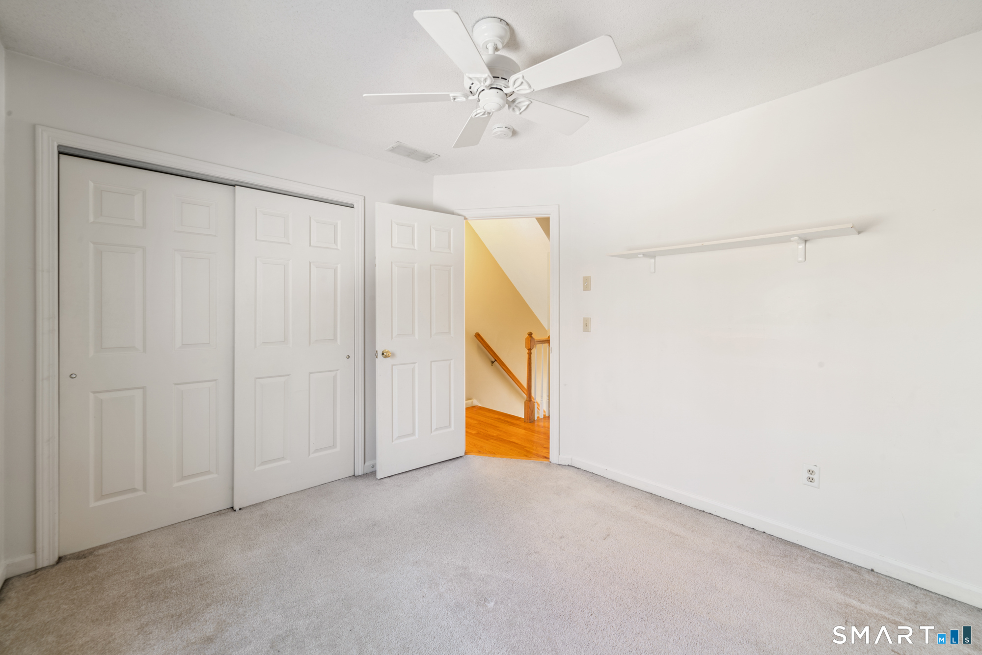165 Garrigus Court Wolcott, CT 06716 - Photo 30 of 40 a view of an empty room with a ceiling fan