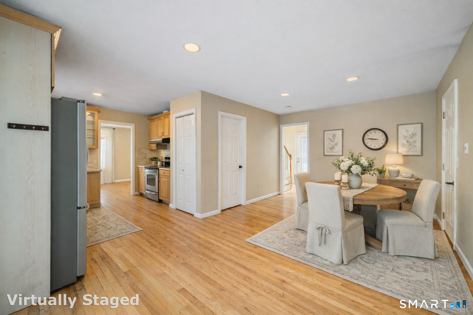 165 Garrigus Court Wolcott, CT 06716 - Photo 8 of 40 a view of a dining room with furniture window and wooden floor