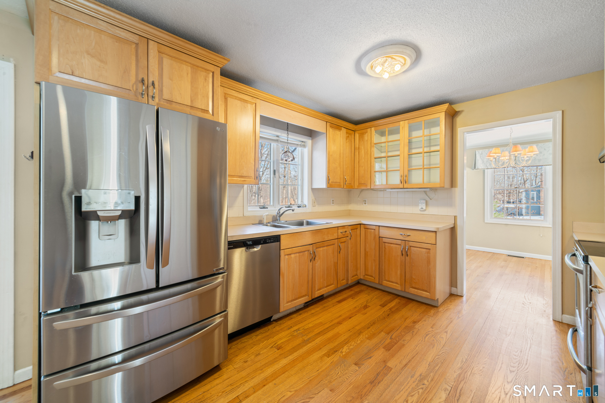 165 Garrigus Court Wolcott, CT 06716 - Photo 9 of 40 a kitchen with stainless steel appliances a refrigerator and a stove top oven