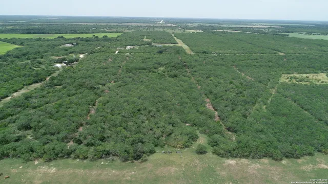 a view of a field with an ocean view