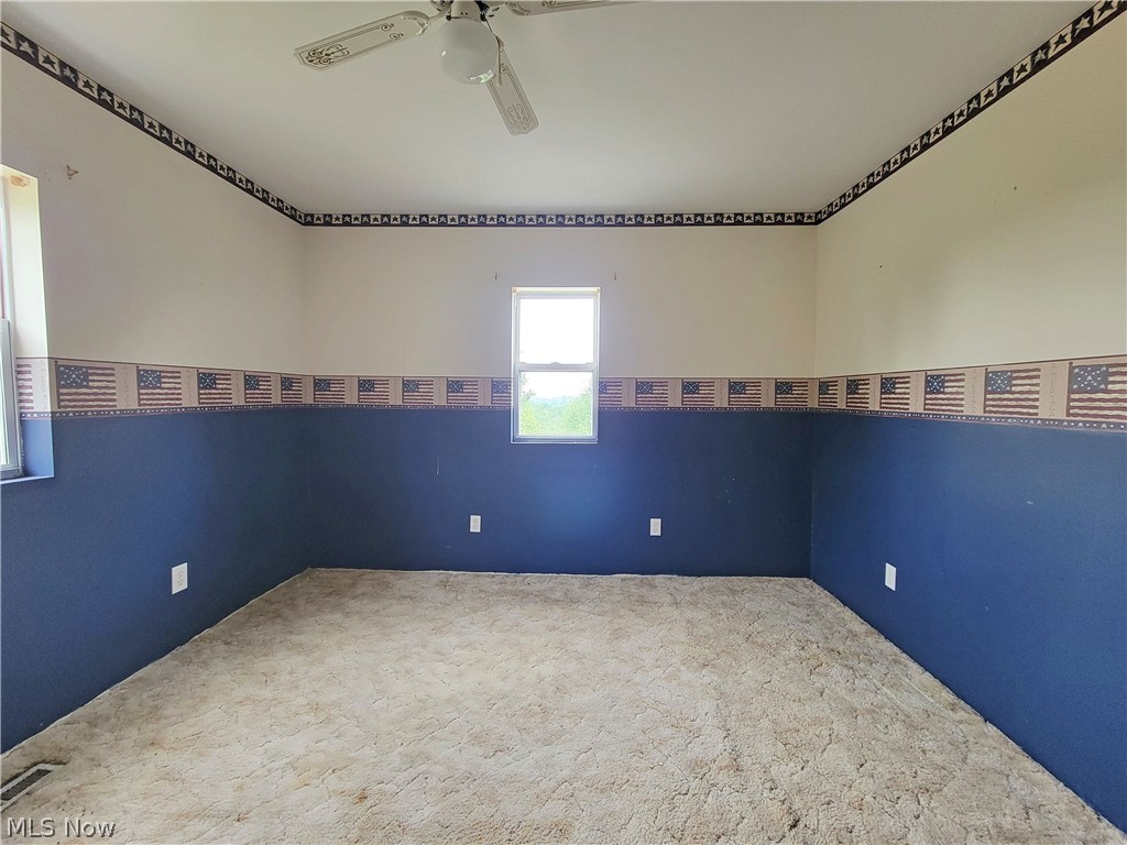 63 Old Ashby Ridge Road Parkersburg, WV 26104 - Photo 10 of 13 Unfurnished room with ceiling fan