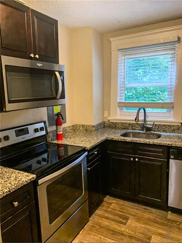 a kitchen with a stove and a microwave