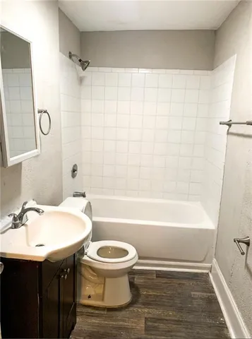 a bathroom with a sink a toilet and a bathtub