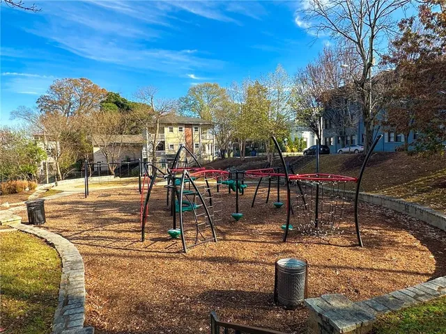 a view of a park with large trees