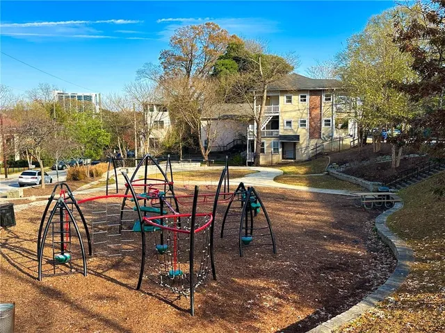 a view of a swimming pool with a table and chairs