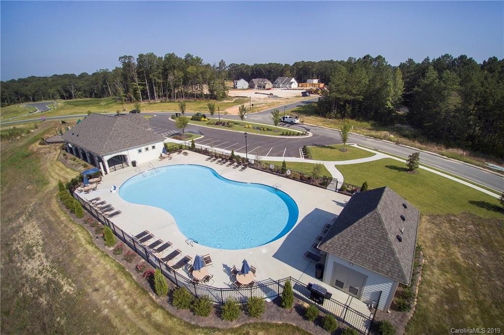 5505 Braddock Ml Way, Unit 273 Lancaster, SC 29720 - Photo 25 of 29 a view of a swimming pool with a patio and a yard