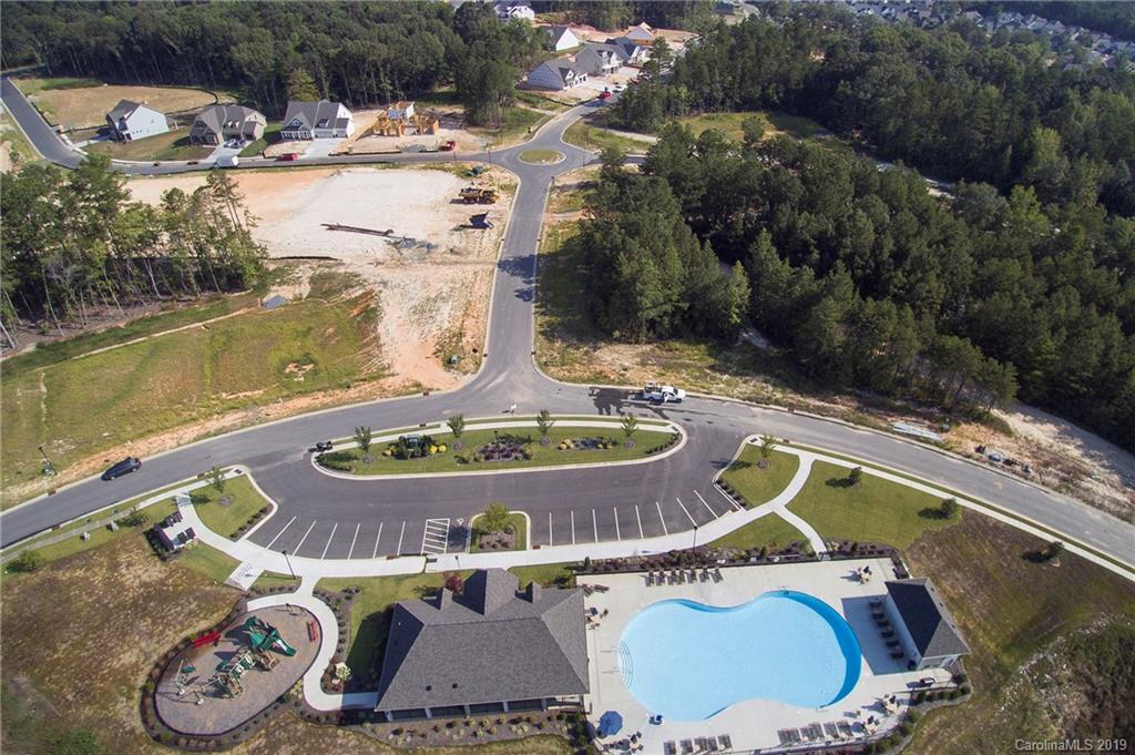 5505 Braddock Ml Way, Unit 273 Lancaster, SC 29720 - Photo 26 of 29 a view of a swimming pool with a yard from a lake view